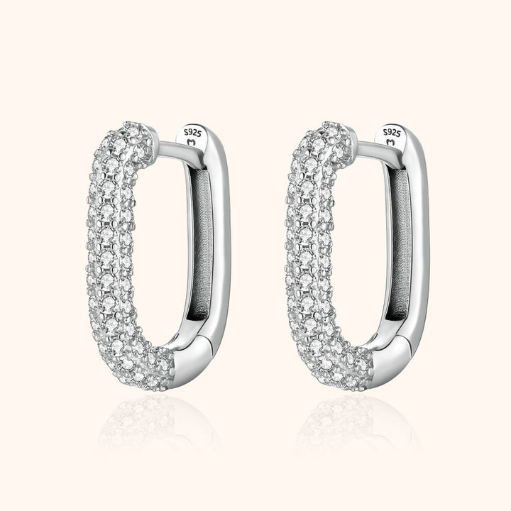 Women's elegant silver & gold hoop earrings with sparkling zirconia stones, part of the Lucienne collection.