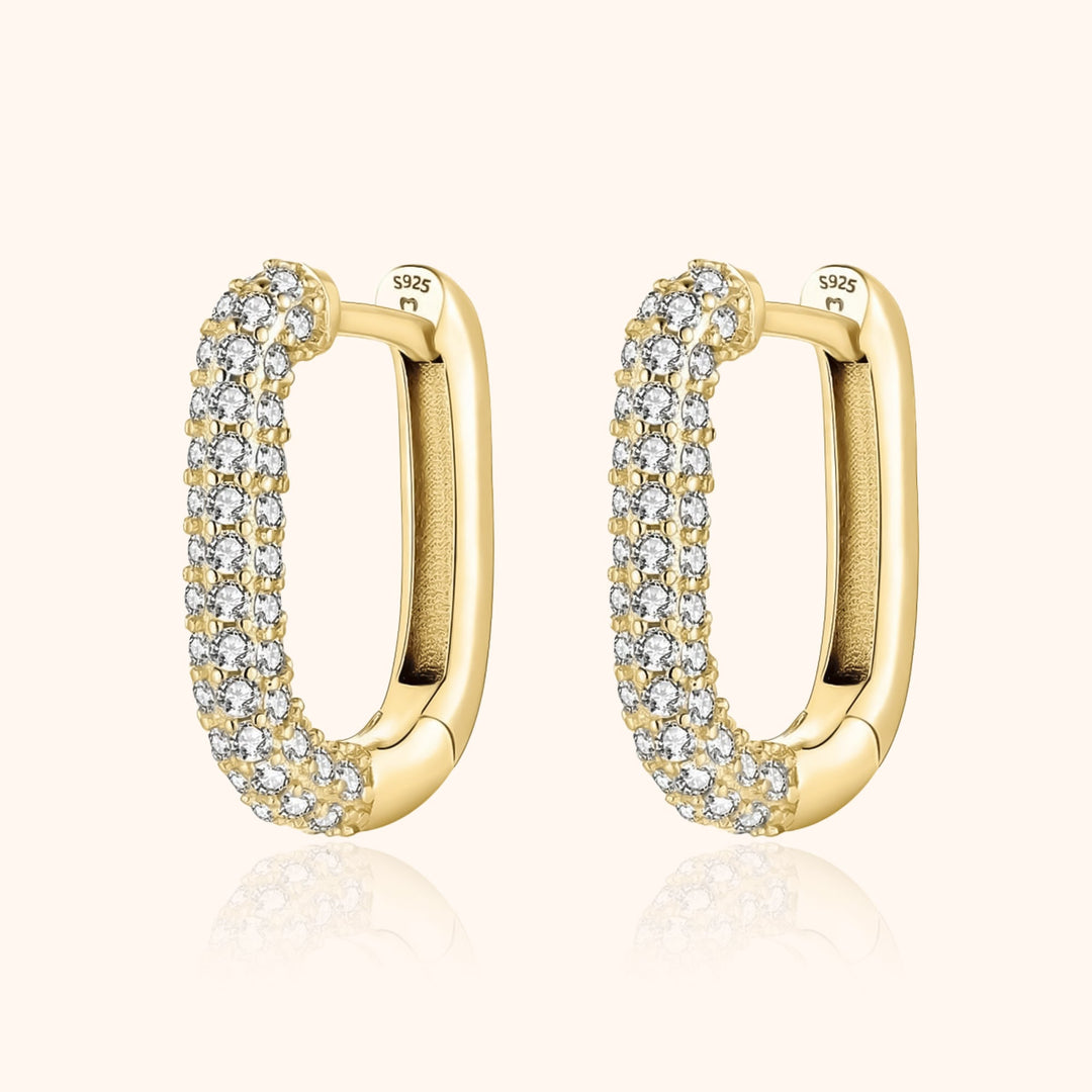 Lucienne women's radiant hoop earrings, crafted from silver & gold, adorned with shimmering zirconia for elegance.
