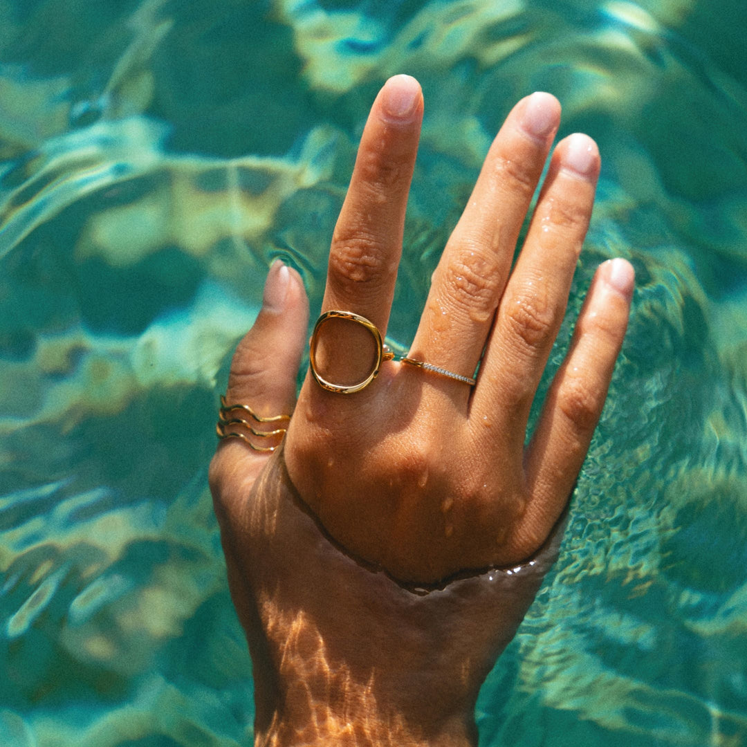 Stylish hypoallergenic gold wave ring for women, water-resistant & durable ocean-inspired fashion.