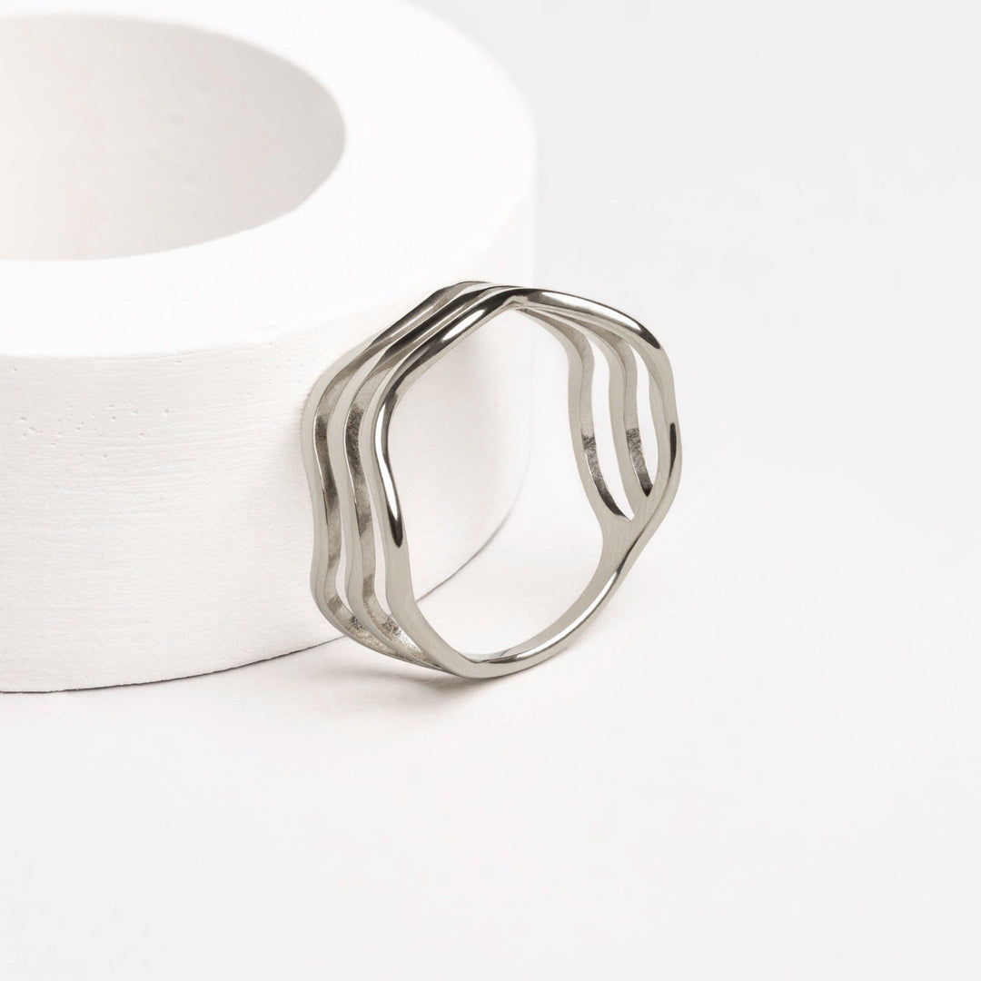 Stackable women's wave ring, a versatile silver ocean design, perfect for fashion-forward everyday wear.