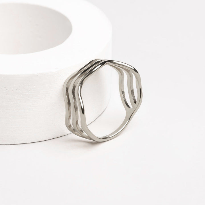 Stackable women's wave ring, a versatile silver ocean design, perfect for fashion-forward everyday wear.