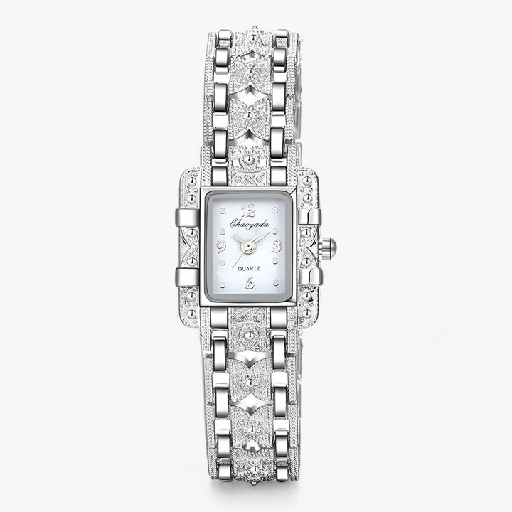 Silver-tone quartz women's watch with a rectangular face and crystal detailing for an elegant look.