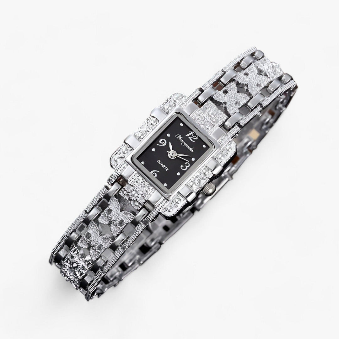 Women's sleek silver rectangular watch with a crystal-studded dial, perfect for a classy outfit.