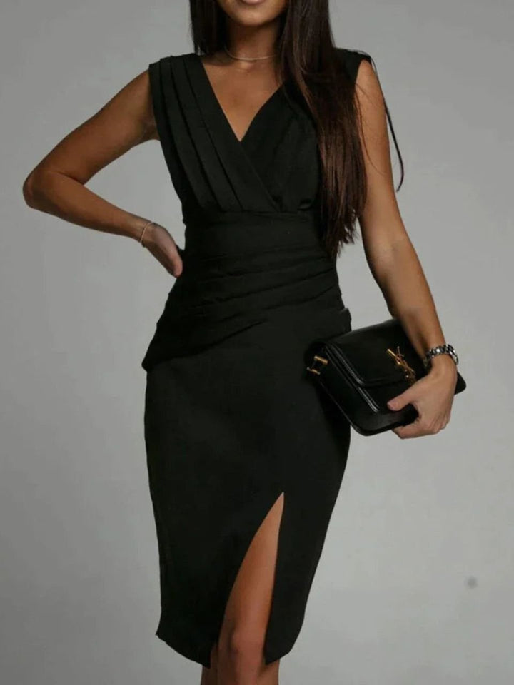 Form-fitting women's sleeveless bodycon midi dress featuring a flattering V-neckline & elegant side slit.