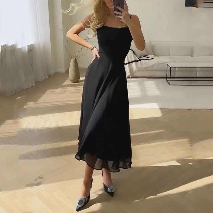 Classic style women's sleeveless midi dress with a flattering fit, versatile for elegant formal wear or casual occasions.