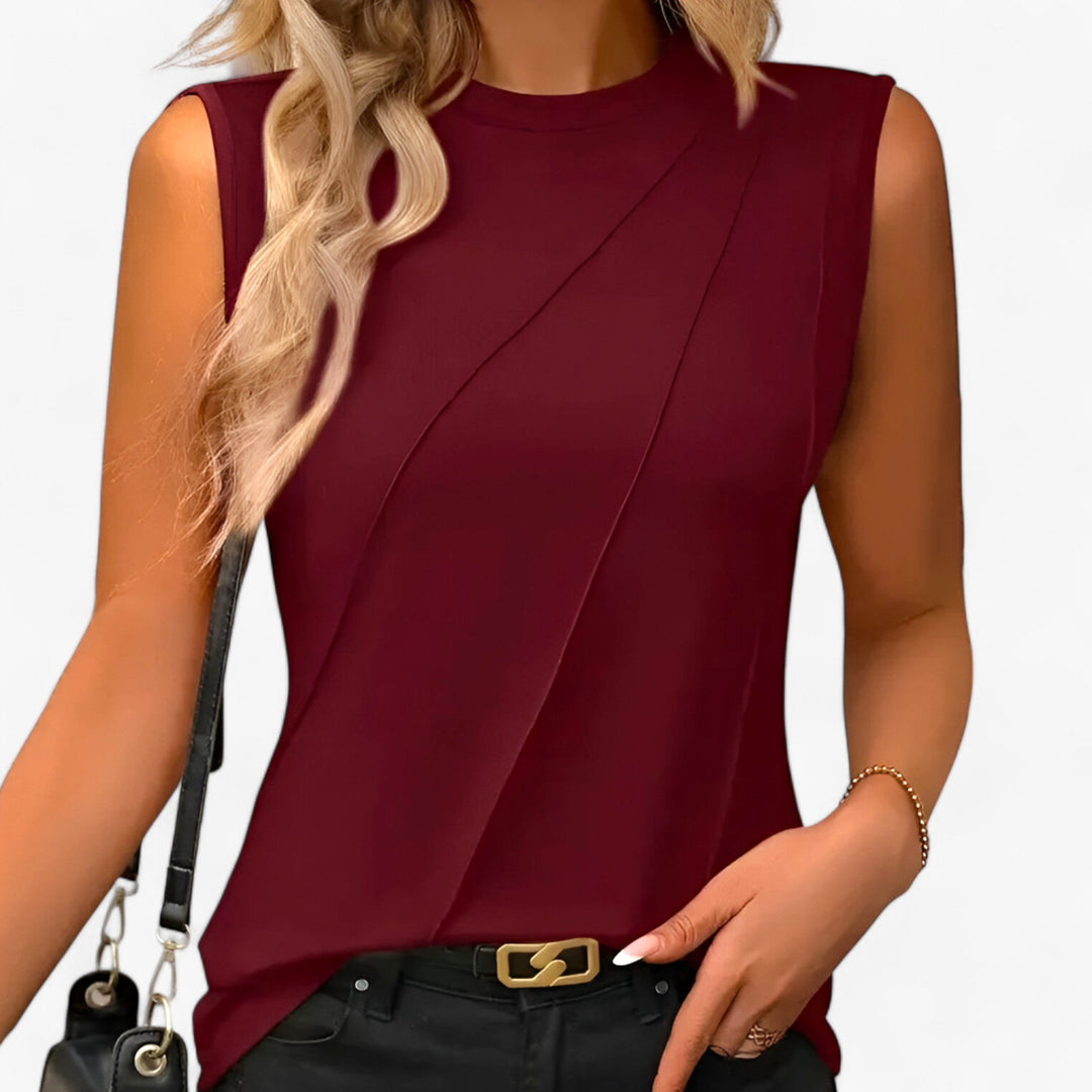 Effortless draped sleeveless mock neck blouse for women, flowing and comfortable, ideal for chic fashion.
