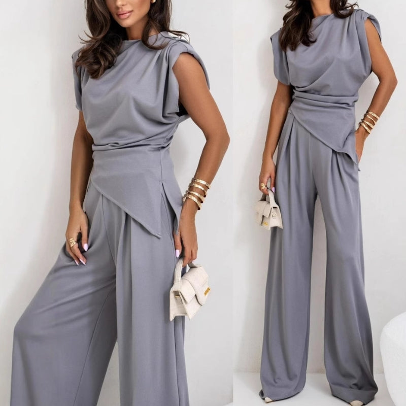 Versatile women's two-piece pants set with sleeveless top, suitable for elegant or casual summer occasions.
