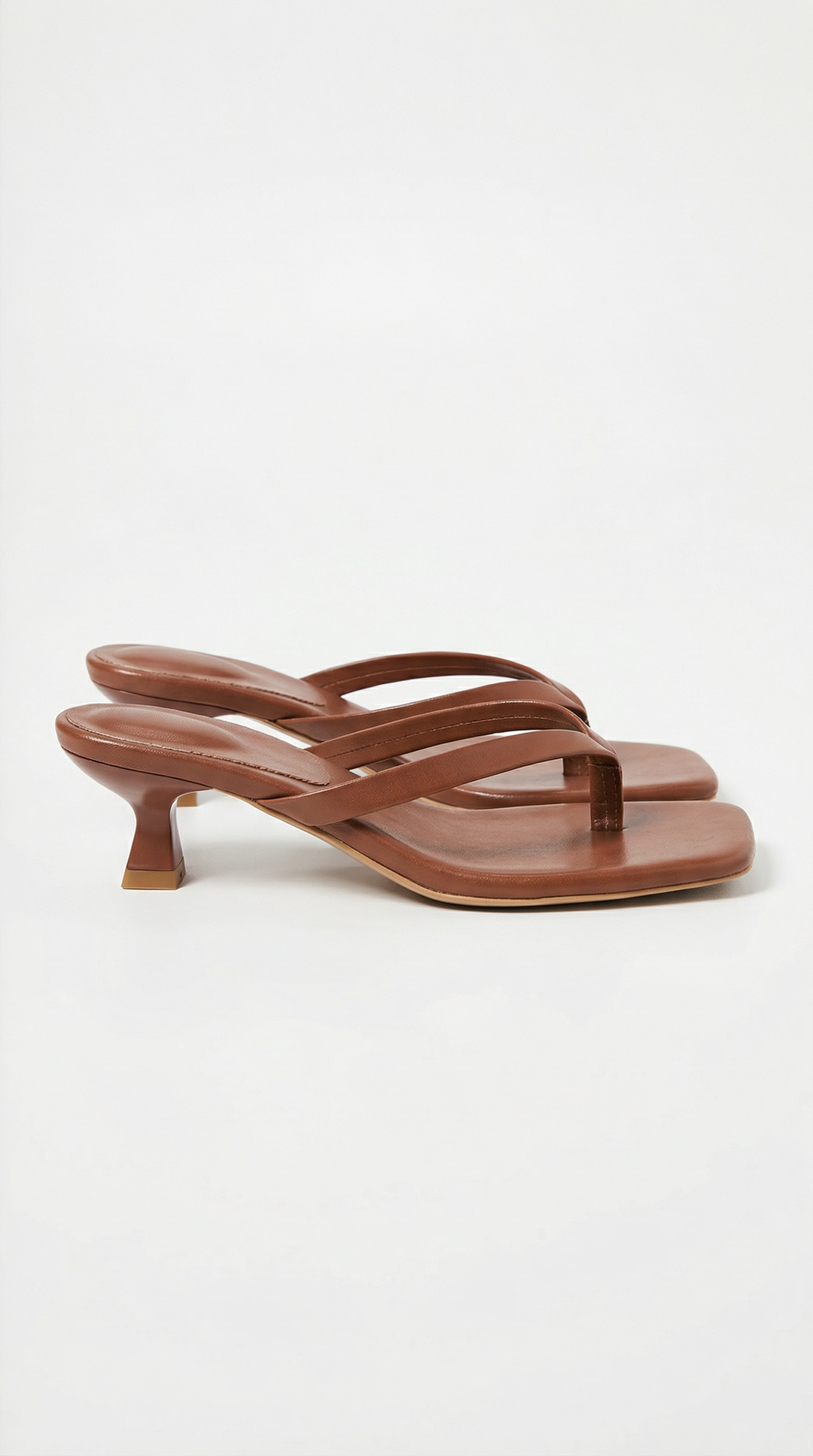 Dressy women's square toe thong sandals, elevated with a comfortable kitten heel for elegant wear.