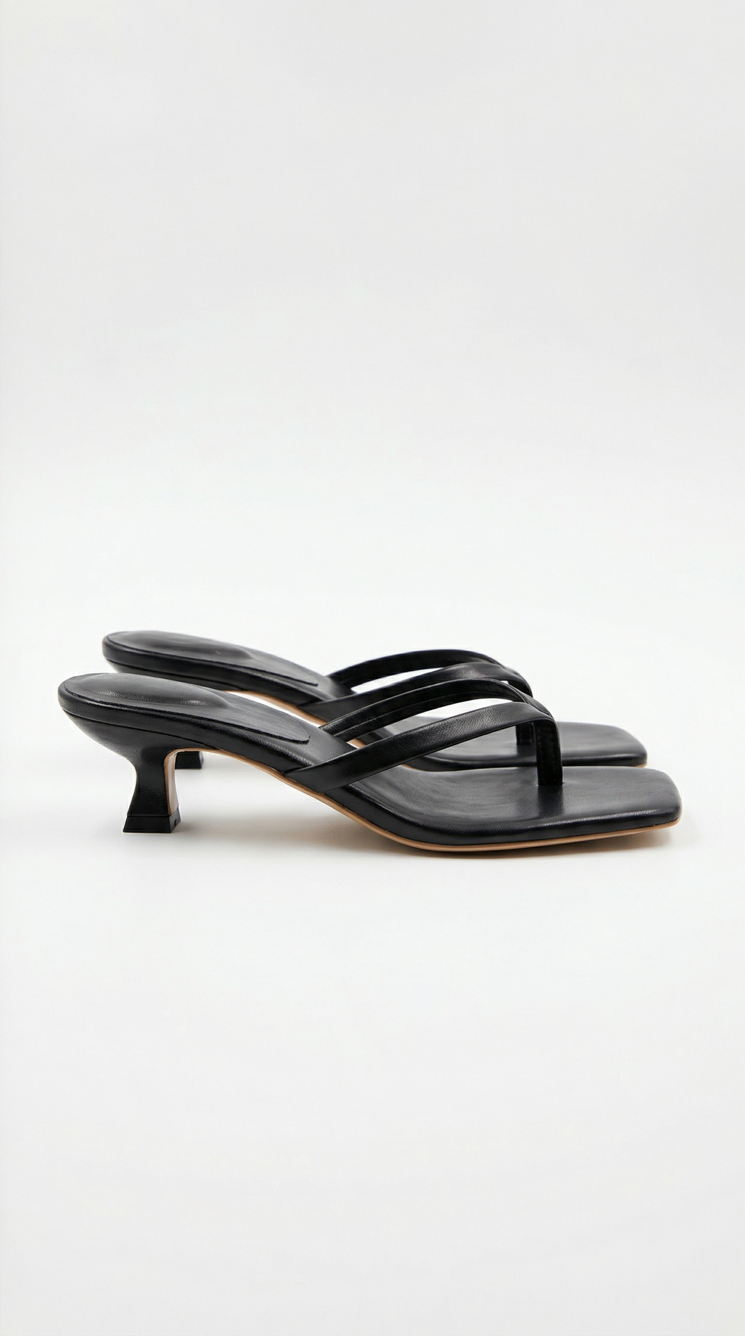 Chic women's dressy square toe thong sandals with a subtle kitten heel. Perfect fashion footwear.
