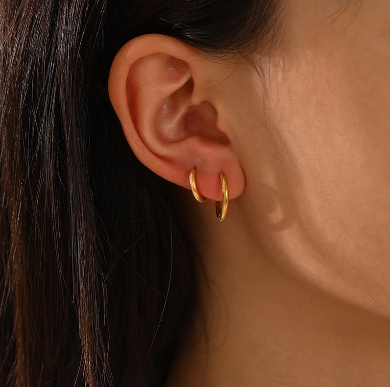Stylish women's gold hoop earrings made of hypoallergenic material, a jewelry classic