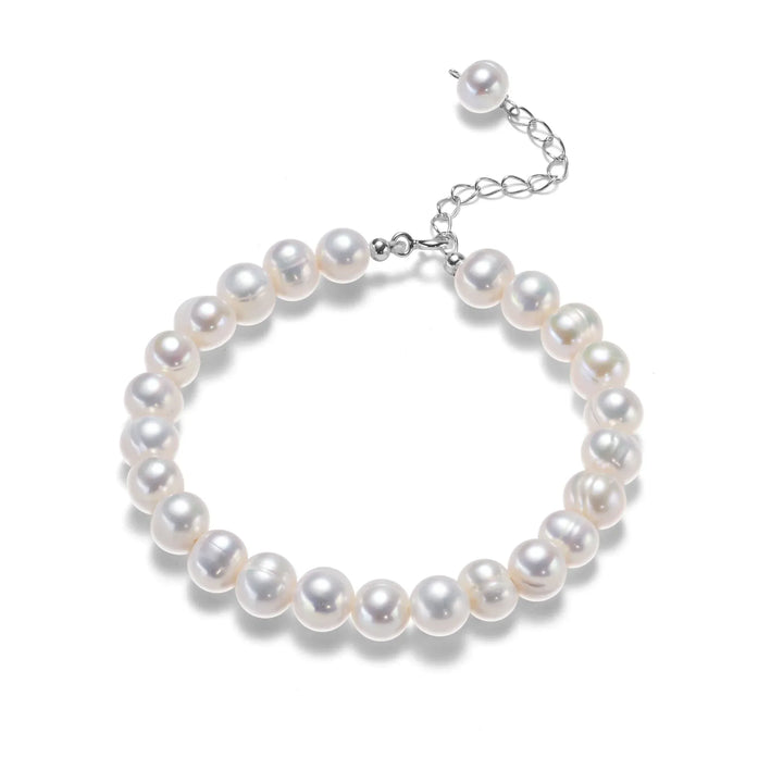 Dainty sterling silver freshwater pearl bracelet for women. Elegant, adjustable, ideal for her.