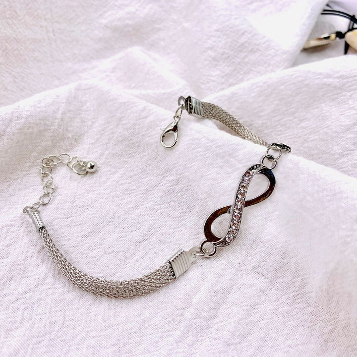 Timeless sterling silver women's infinity bracelet, elegant, adjustable jewelry for any occasion.