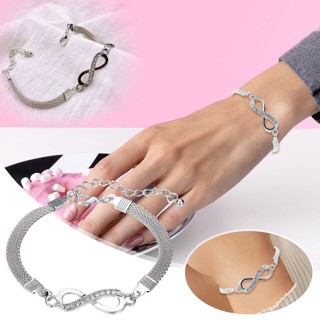 Detailed shot of the delicate infinity symbol on a sterling silver women's bracelet, elegant jewelry.