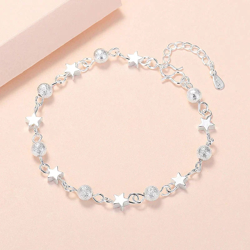 Women's elegant sterling silver star bracelet, a beautiful celestial jewelry piece.
