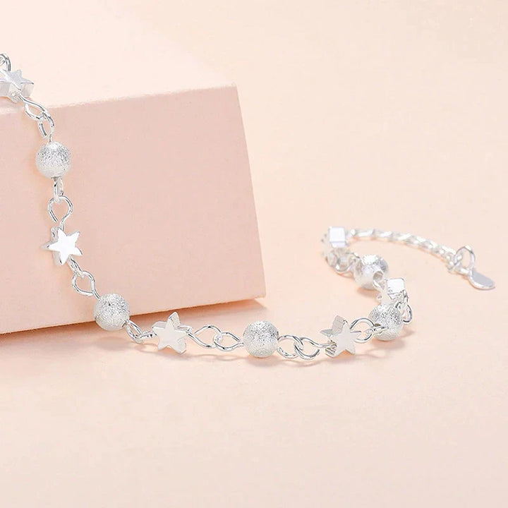 Elegant women's celestial star bracelet in sterling silver, a perfect jewelry gift for her.