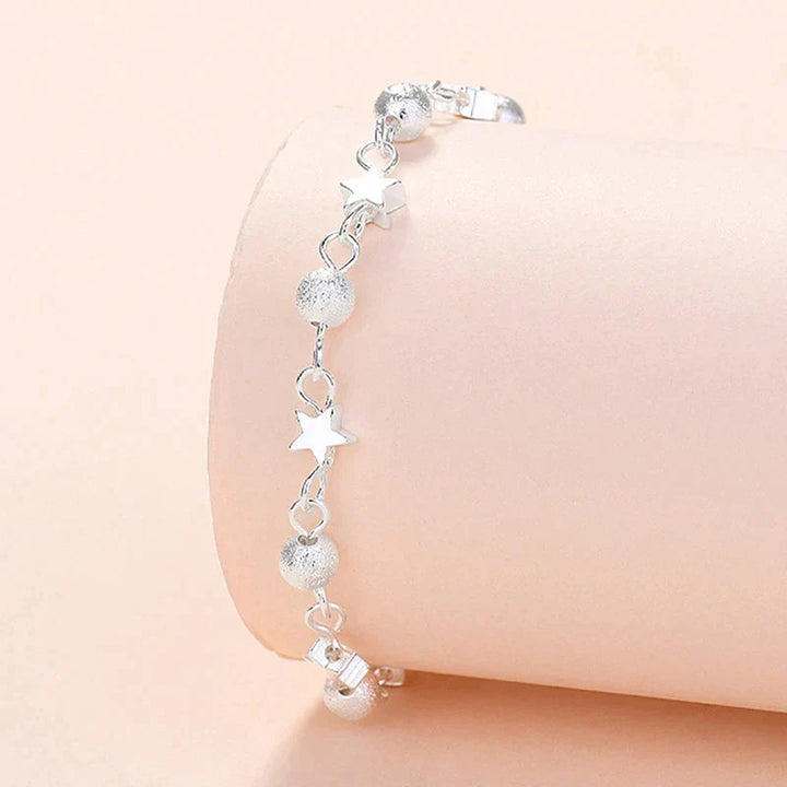 Dainty sterling silver star bracelet for women, a timeless and elegant celestial jewelry design.