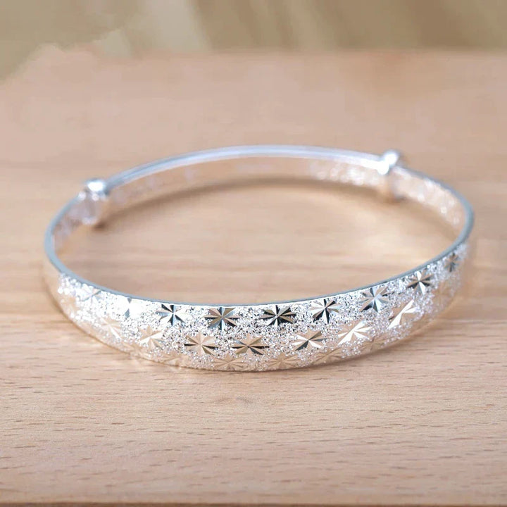 Stunning women's silver star charm bracelet, sterling silver, adjustable for a perfect fit.