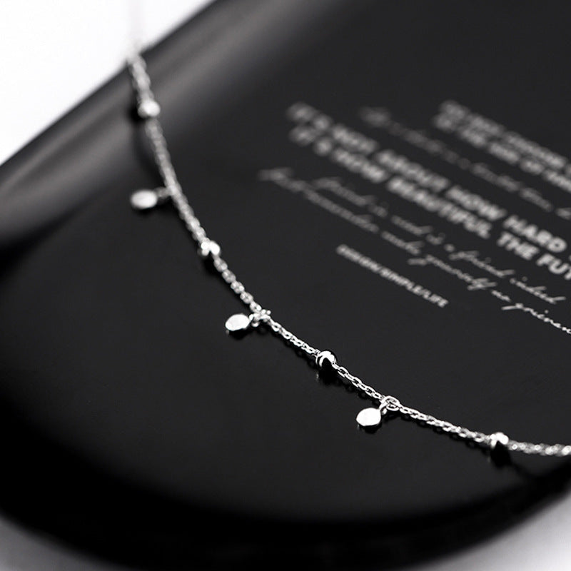 Close-up of the elegant silver teardrop pendant, sparkling women's fashion jewelry gift.