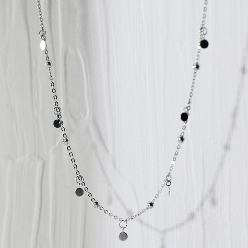 Elegant silver teardrop necklace paired with earrings, stylish women's jewelry for any occasion.