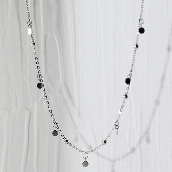 Elegant silver teardrop necklace paired with earrings, stylish women's jewelry for any occasion.