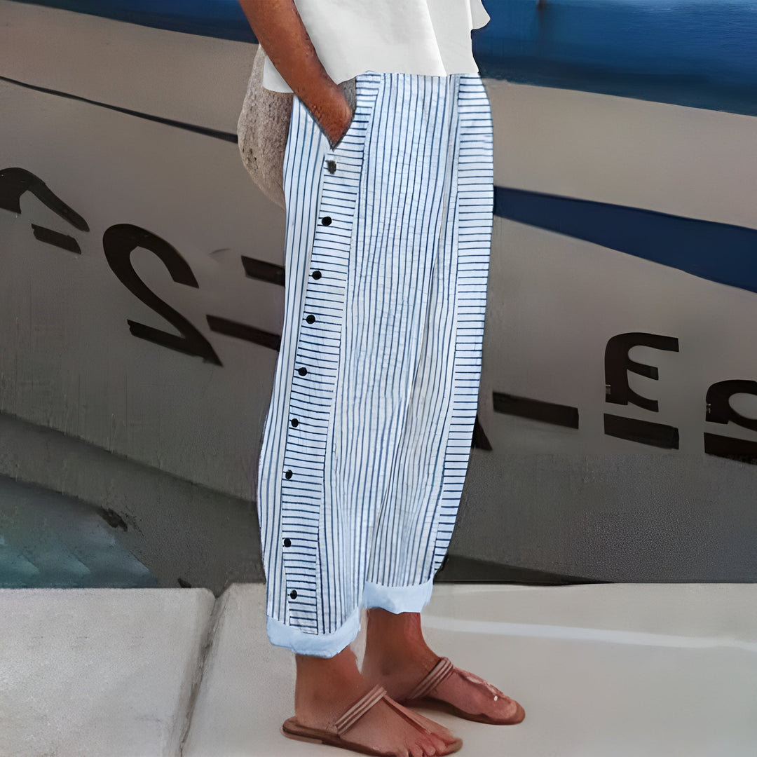 Women's elegant stripe panel cropped trousers with button detail. Perfect straight leg pants for spring fashion.