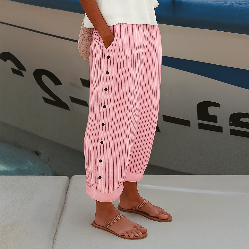 Women's casual chic cropped trousers with a distinctive stripe panel and decorative button details. Great for spring.