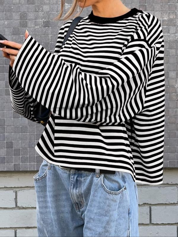 Women's elegant striped bell sleeve top. Stylish, relaxed fit sweater with modern statement sleeves for versatile fashion.