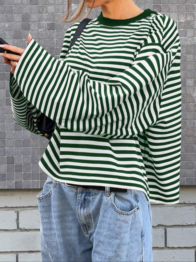 Versatile women's striped bell sleeve top. Elegant and modern sweater, suitable for various sophisticated outfits.