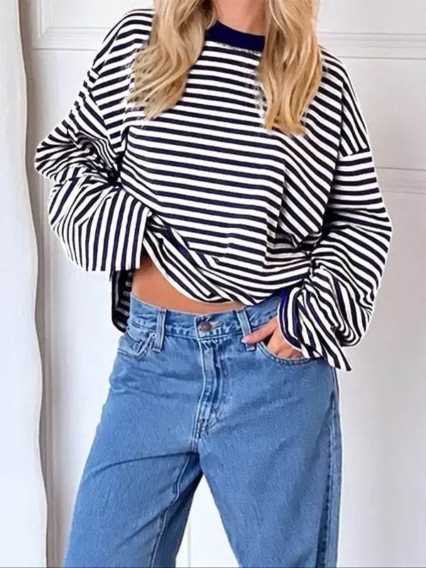 Comfortable women's relaxed fit striped bell sleeve top. Elegant and modern sweater for stylish, effortless fashion.
