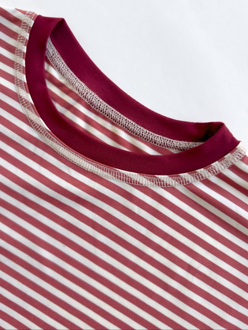 Chic women's striped sweater with elegant bell sleeves. A versatile and stylish modern top for sophisticated looks.