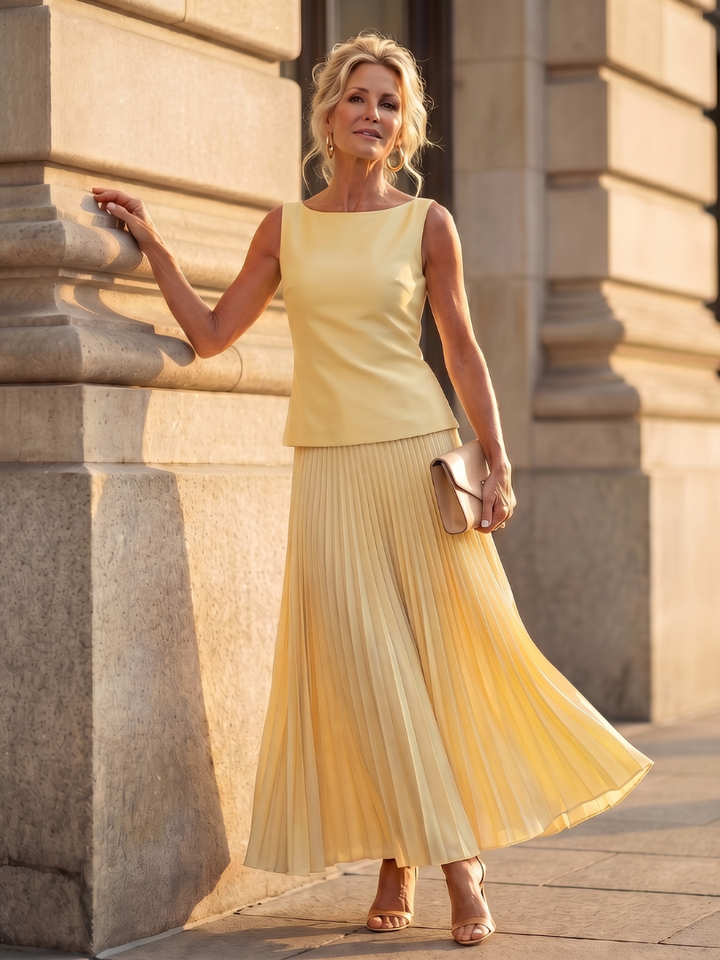 Women's elegant structured bodice & pleated maxi skirt set, perfect for formal occasions.
