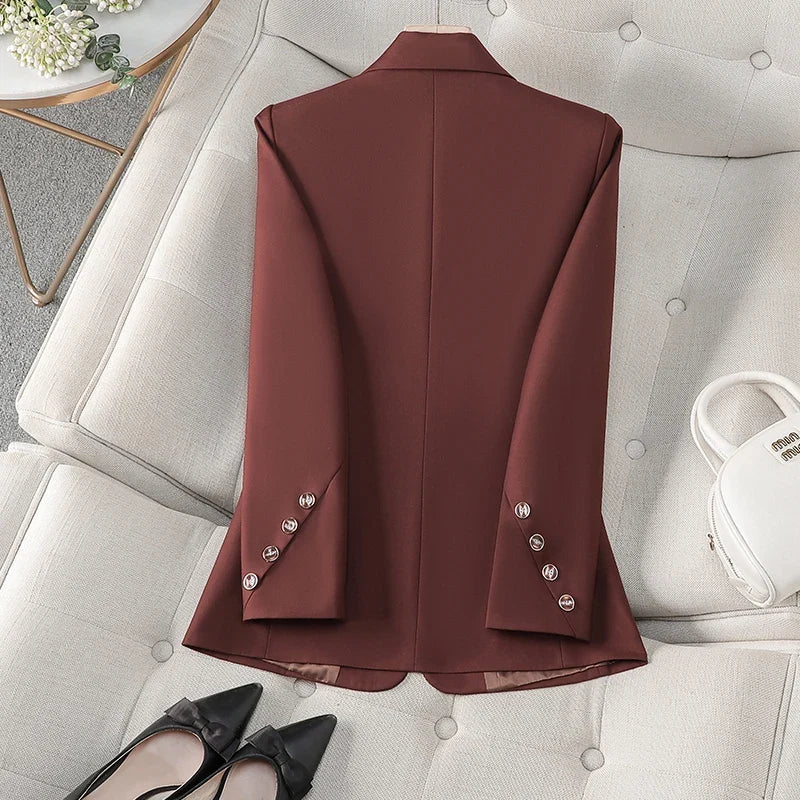 Crisp white women's tailored blazer, exuding sophisticated fashion & elegant style for professional or casual wear.