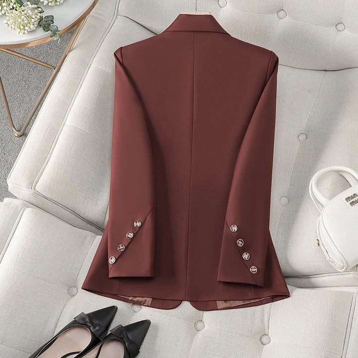 Crisp white women's tailored blazer, exuding sophisticated fashion & elegant style for professional or casual wear.
