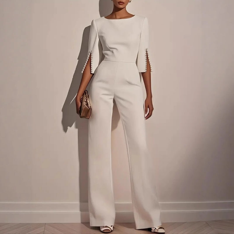 Women's elegant tailored jumpsuit with sophisticated pearl detailing. Ideal for formal events & evening wear.