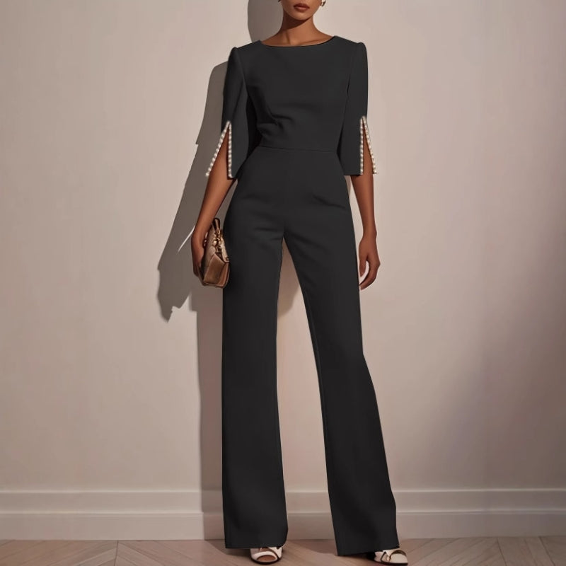 Dressy women's jumpsuit with unique pearl details, offering a smart casual to formal style.