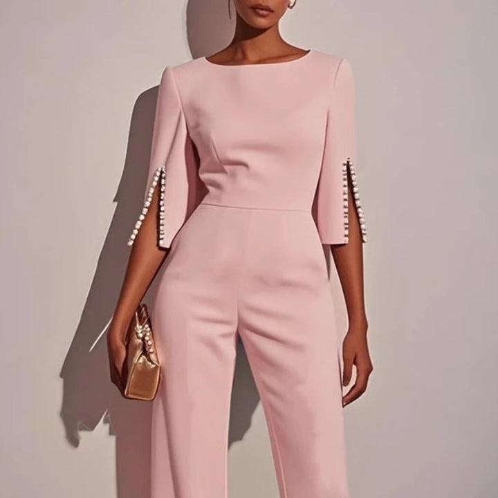 Chic women's tailored jumpsuit, designed for elegance and comfort, adorned with subtle pearl details.