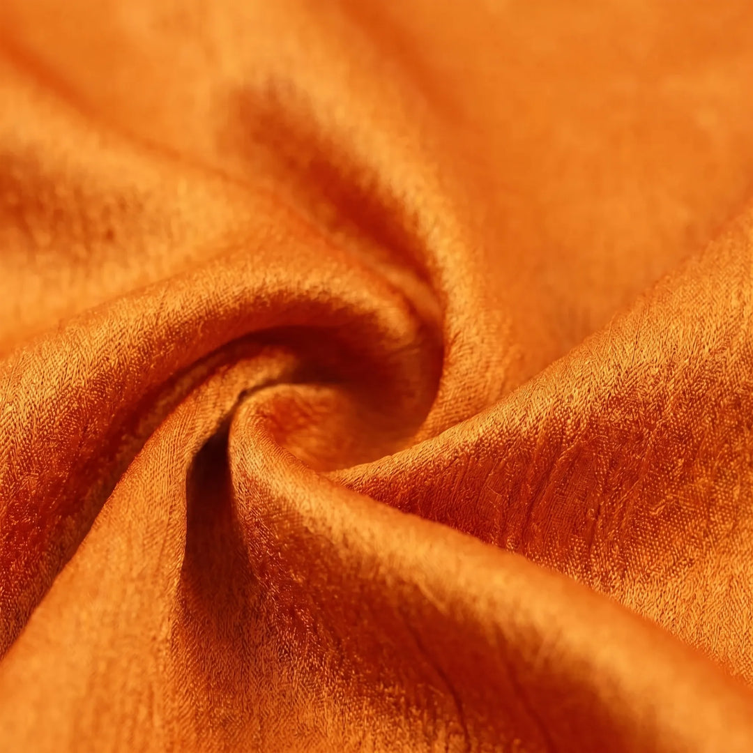 Textured women's sleeveless top, featuring an elegant tie-waist design and draped neckline.