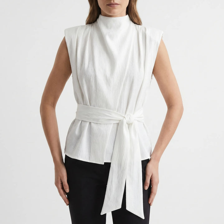 Versatile women's sleeveless blouse, featuring a trendy tie-waist and sophisticated design.