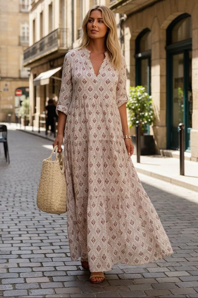 Flowy women's tiered maxi dress, perfect for summer vacation wear or spring casual chic.