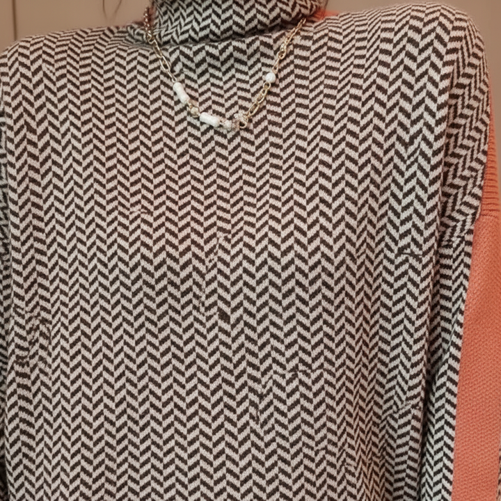 Close-up of women's knitted turtleneck sweater, showing elegant texture and cozy polyester blend fabric