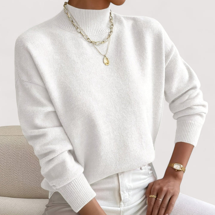 Women's elegant turtleneck sweater in soft knit, perfect for stylish winter outfits. Cozy long-sleeve top.