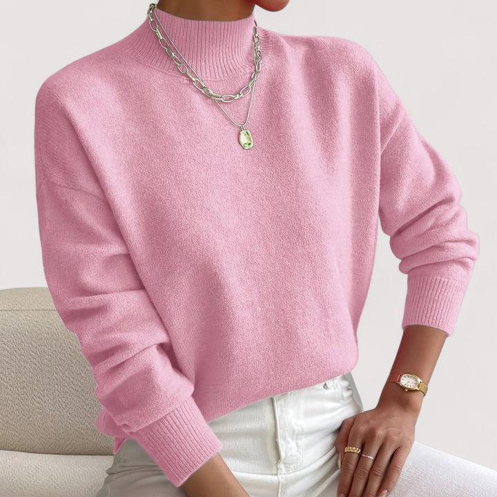 Cozy women's turtleneck sweater for winter fashion. Soft knit long-sleeve top for warmth & style.