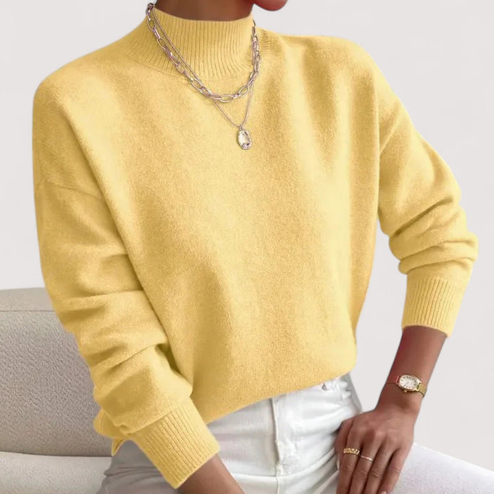 Stylish women's turtleneck knit sweater, a casual chic fall essential. Long-sleeve for comfortable wear.