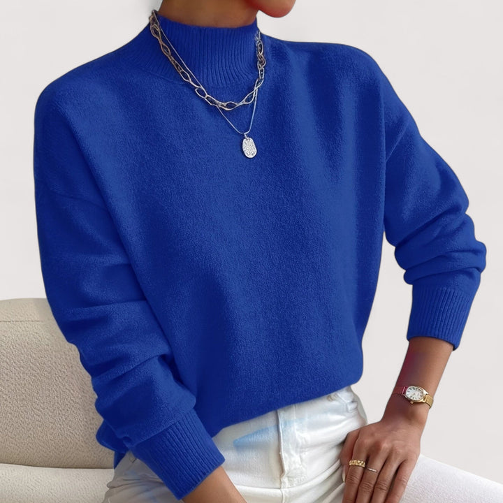 Soft knit women's turtleneck sweater, elegant long-sleeve top for cozy winter and fall fashion.