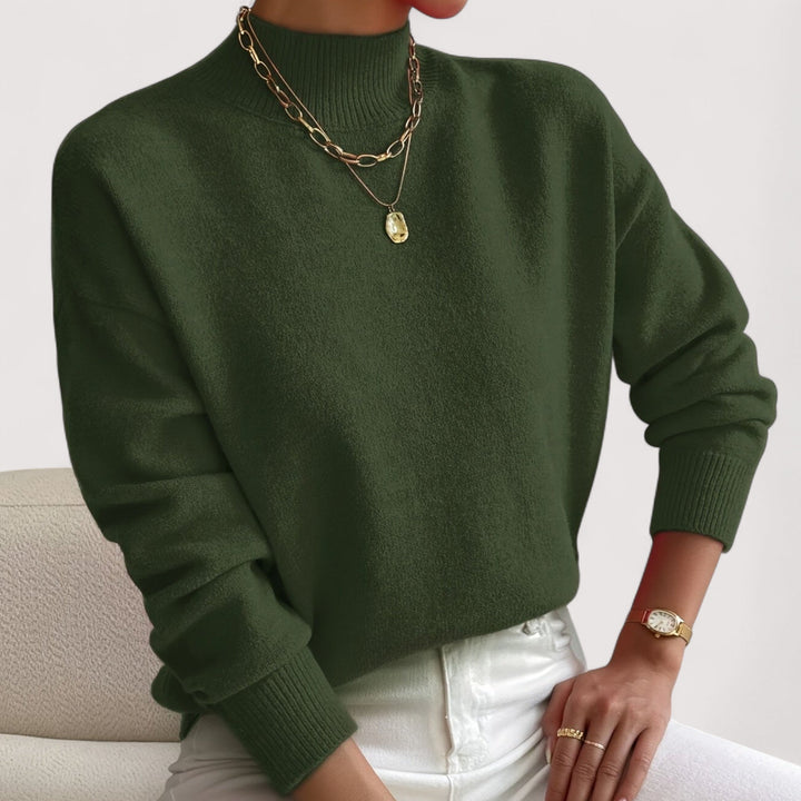 Sophisticated women's high-neck knit sweater, a cozy long-sleeve top for elegant fall and winter style.