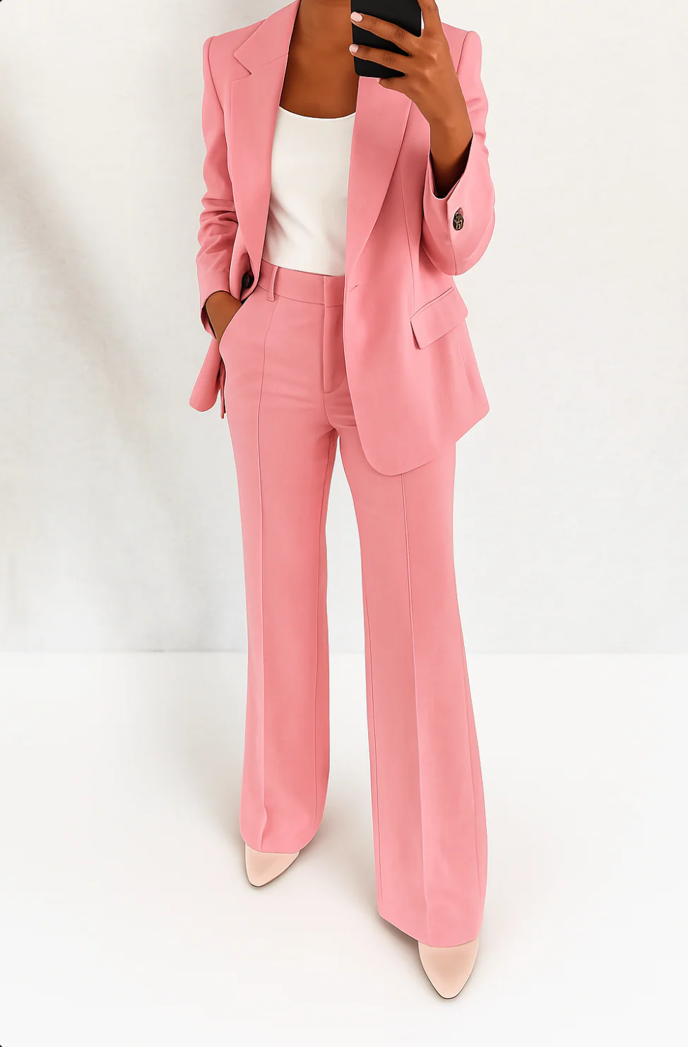 Women's formal two-piece suit: chic blazer and wide-leg pants for elegant business attire & professional events.