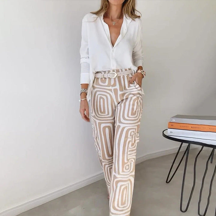 Khaki women's elegant two-piece set with a flowing top & patterned trousers. Sophisticated & versatile day-to-night outfit.