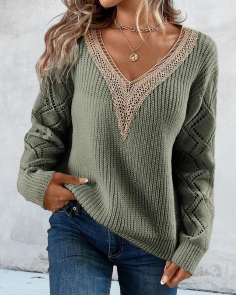 Elegant women's V-neck color block sweater, offering comfort & style for any modern wardrobe.