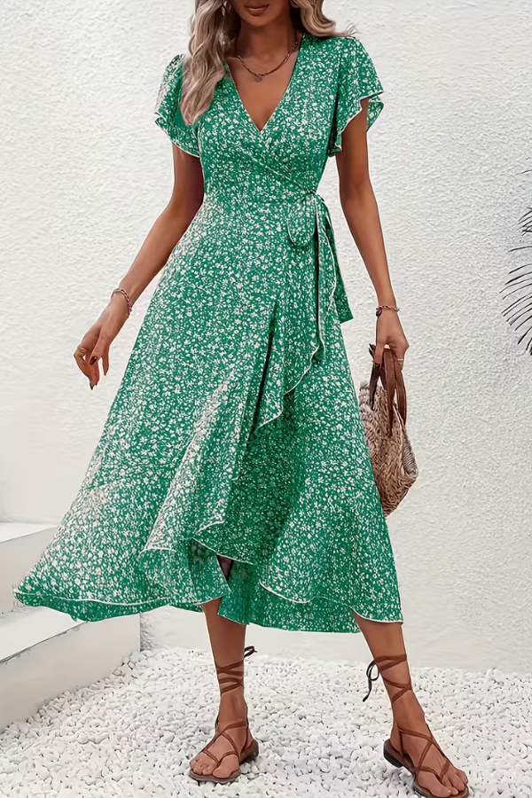 Women's flattering V-neck floral midi dress, combining style and comfort for summer.
