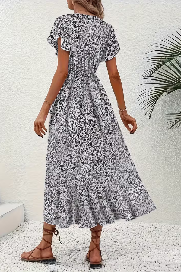 Stylish women's party dress: V-neck floral design with a flattering, elegant fit.